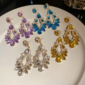 Close-up of luxury palace style rhinestone waterdrop earrings in vibrant colors