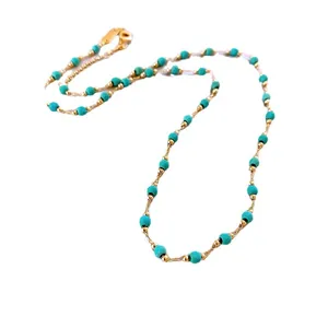 Elegant retro gold-plated beaded necklace featuring turquoise-colored faceted stones.