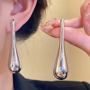 Elegant silver teardrop pendant earrings with a high-shine polished finish for women