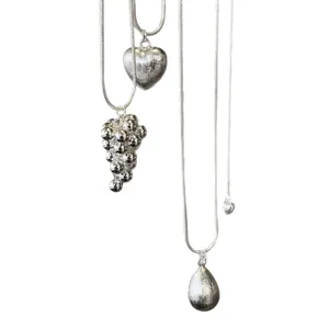Elegant brushed silver adjustable necklace with heart, water drop, and grape cluster charms