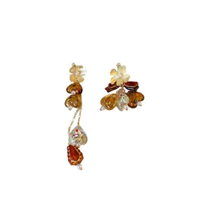 Asymmetrical flower tassel earrings in retro amber tones for autumn and winter