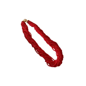 Elegant multi-strand red beaded necklace featuring a sparkling magnetic rhinestone clasp