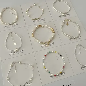 Elegant French vintage pearl bracelets with gold and silver accents on display cards