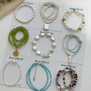 Detailed grid view showcasing a collection of vintage pearl and colorful stone bracelets