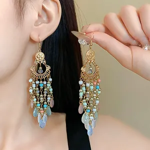 Detail of Bohemian vintage tassel earrings with colorful rice beads and crystals