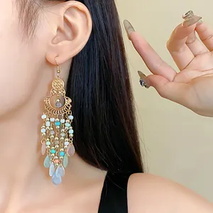 Detail of Bohemian vintage tassel drop earrings with colorful crystal beads
