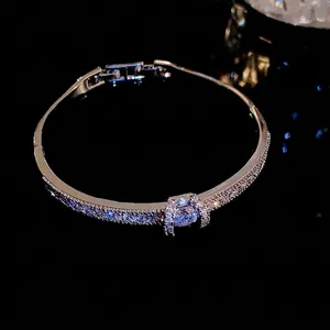 Sparkling silver-tone bangle bracelet with cubic zirconia solitaire and pave stones