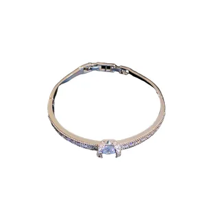 Elegant silver-toned bangle bracelet encrusted with sparkling cubic zirconia stones
