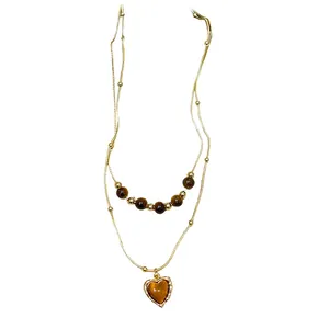 Vintage double layer gold chain necklace featuring tiger eye beads and a heart pendant charm