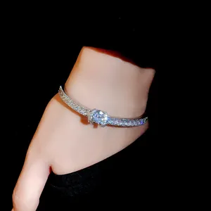 Close-up detail of an elegant silver bracelet encrusted with sparkling zircon diamonds