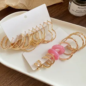 Stylish gold hoop earrings set with minimalist vintage heart designs for women