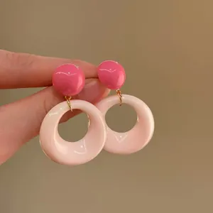 Detailed view of stylish retro round pink contrast color stud earrings for women