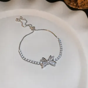 Sparkling cubic zirconia bow adjustable bracelet in elegant silver-plated finish