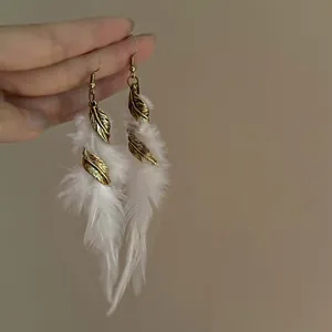 Handheld bohemian white feather tassel earrings with vintage gold leaf accents