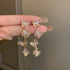 Detailed view of elegant zircon butterfly tassel earrings with sparkling crystals.