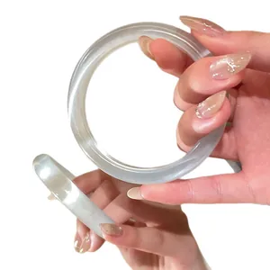 Elegant icy translucent resin round bangle bracelet for women presented in hand