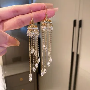 Elegant long gold chain tassel drop earrings with sparkling teardrop crystal charms