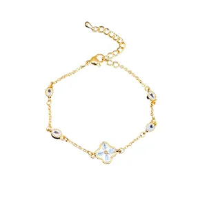 Elegant gold plated bracelet with sparkling zircon flower charm and oval stone accents