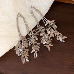 Elegant silver leaf tassel earrings with detailed wheat ear design and metallic finish