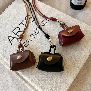 Vintage leather mini bag necklace for coins and earphones in black brown and red