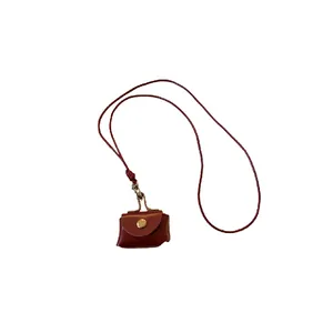 Retro brown leather pouch necklace for coins or earbuds as fashion sweater chain