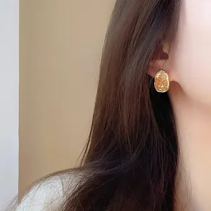 Elegant gold oval earrings with crystal texture, Korean style stud earrings for women