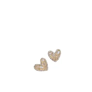 Elegant heart-shaped crystal stud earrings with shiny pavé border and silver needles