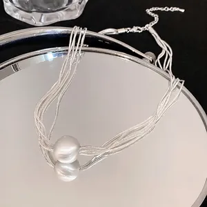Elegant multi-strand silver necklace with a minimalist round pearl bead pendant for women