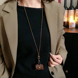 Vintage brown leather coin pouch necklace and earphone bag for stylish accessories
