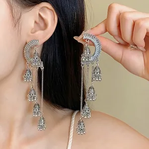 Elegant vintage silver tassel earrings in ethnic palace style with delicate bell charms