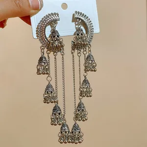 Vintage silver-toned tiered bell tassel earrings with intricate ethnic palace metalwork
