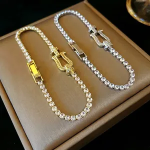 Elegant cubic zirconia horseshoe buckle bracelet for women in gold and silver finish