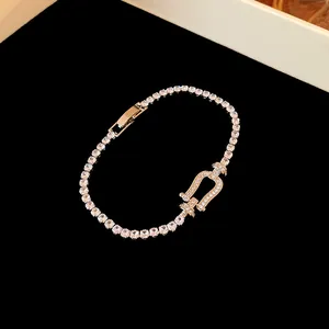 Macro detail of luxury silver horseshoe buckle bracelet with shimmering zircon stones