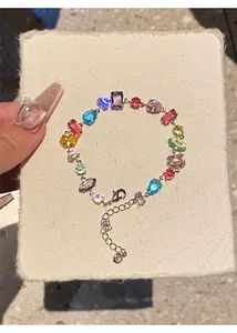 Detailed view of a colorful zircon bracelet featuring teardrop and square cut stones.