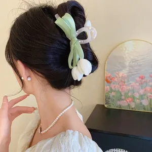 Elegant white tulip and light green mesh bow hair claw clip for women's stylish hair styling