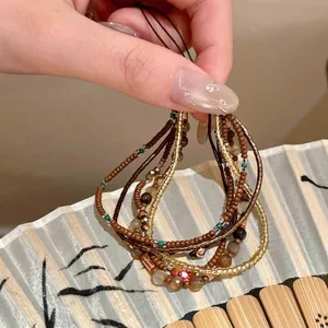 Close-up of New Chinese style wooden beaded bracelet with elegant colorful accents