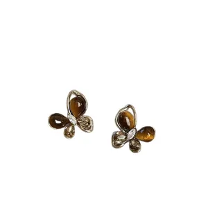Elegant butterfly stud earrings with sparkling zircon and faux tiger eye stones decoration