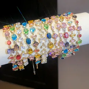 Detailed macro view of vibrant multi-colored zircon bracelets with sparkling lens flare effect