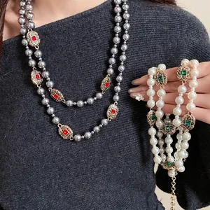 Elegant vintage pearl necklace set with colorful rhinestone accents for a retro look
