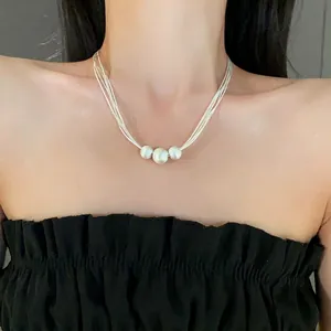 French Baroque pearl pendant necklace with minimalist multi-strand chain for women