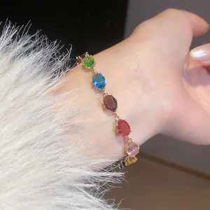 Elegant close-up view of a vibrant multicolor zircon bracelet styled on a delicate wrist
