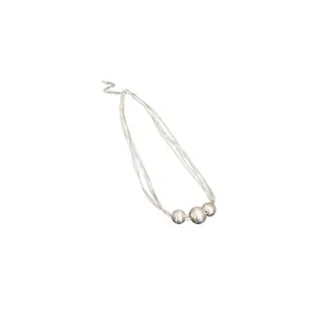 Minimalist silver multi-strand necklace with three matte metallic spherical pendants