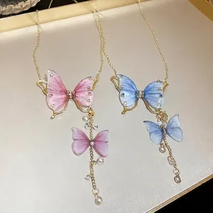 Elegante Tüll-Schmetterlingskette mit Strasssteinen und Perlen an goldener Kette