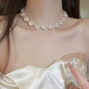 Elegant irregular baroque pearl necklace worn on collarbone for women
