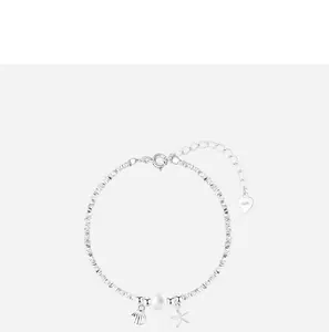 Close-up of silver-tone beaded bracelet featuring pearl, shell, and starfish charms