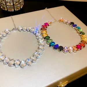 Elegant teardrop crystal necklaces in clear and rainbow colors with brilliant sparkle effect.