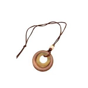 Vintage ethnic style long necklace with geometric wood-like double ring pendant on white background