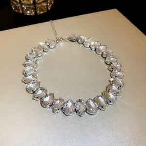 Macro view of luxurious teardrop crystal necklace with shimmering multifaceted stones