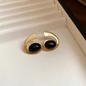 Boucles d'oreilles spirales géométriques vintage avec pierre noire ovale et fini doré