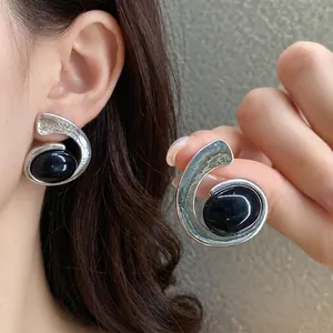 Boucles d'oreilles spirales argentées rétro avec pierre noire ovale, style vintage
